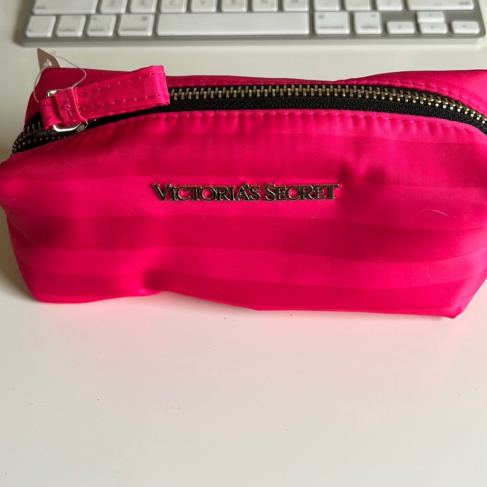 Victoria Secret pink cosmetic case.